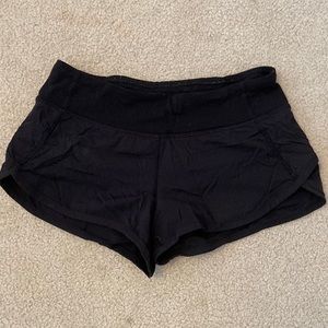 black ivviva shorts. With zipper pocket on the back.